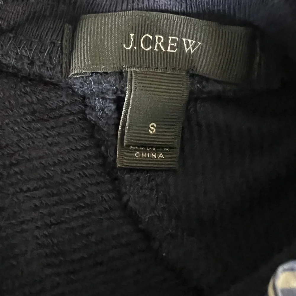 J.Crew dark blue women’s small sweater with blue & white ruffle trim.